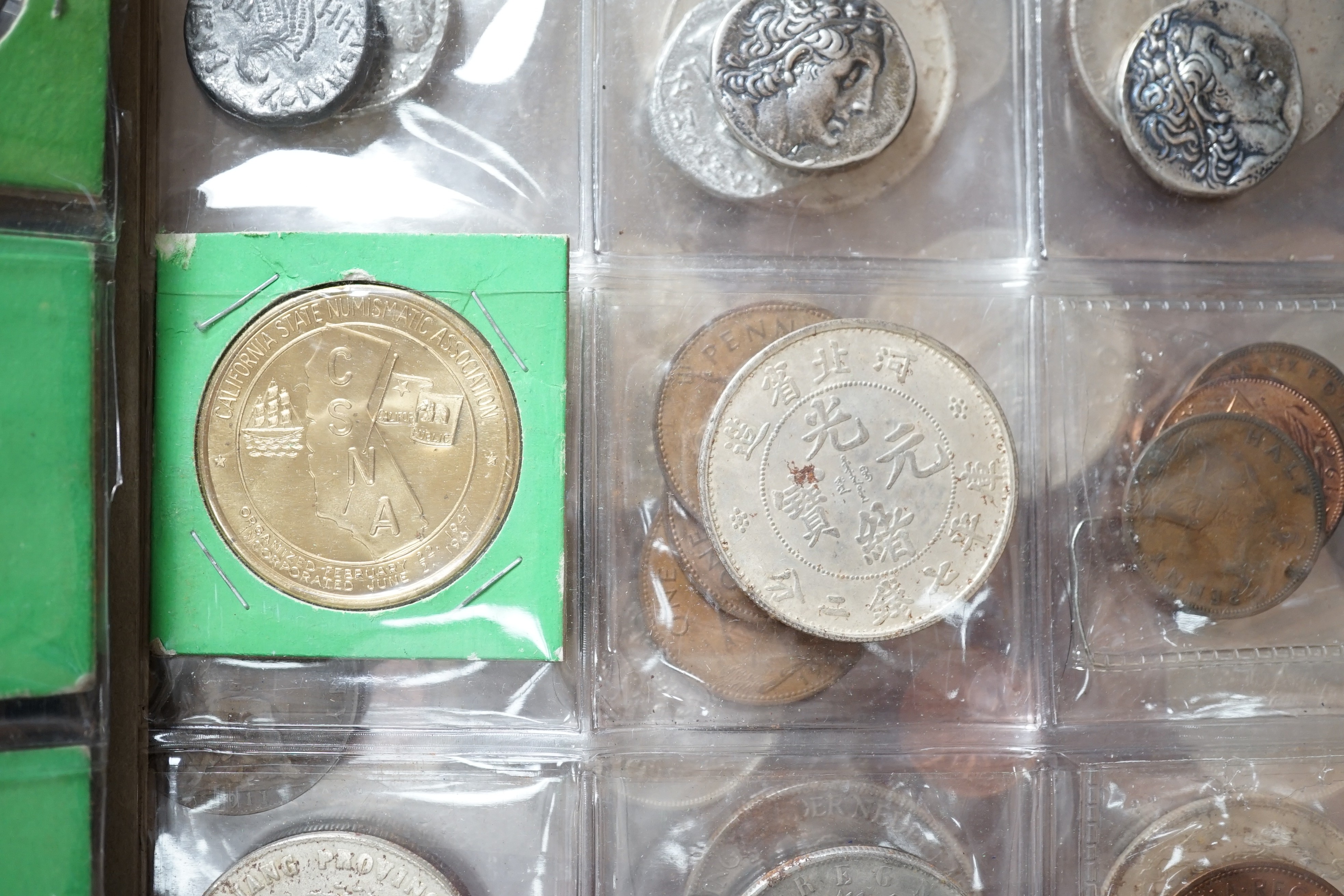 Coins in an album, including reproductions